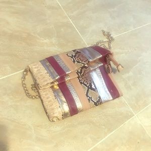 Clutch snakeskin bag. Chain strap is detachable.